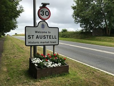 flower bed under st austell sign with flowers