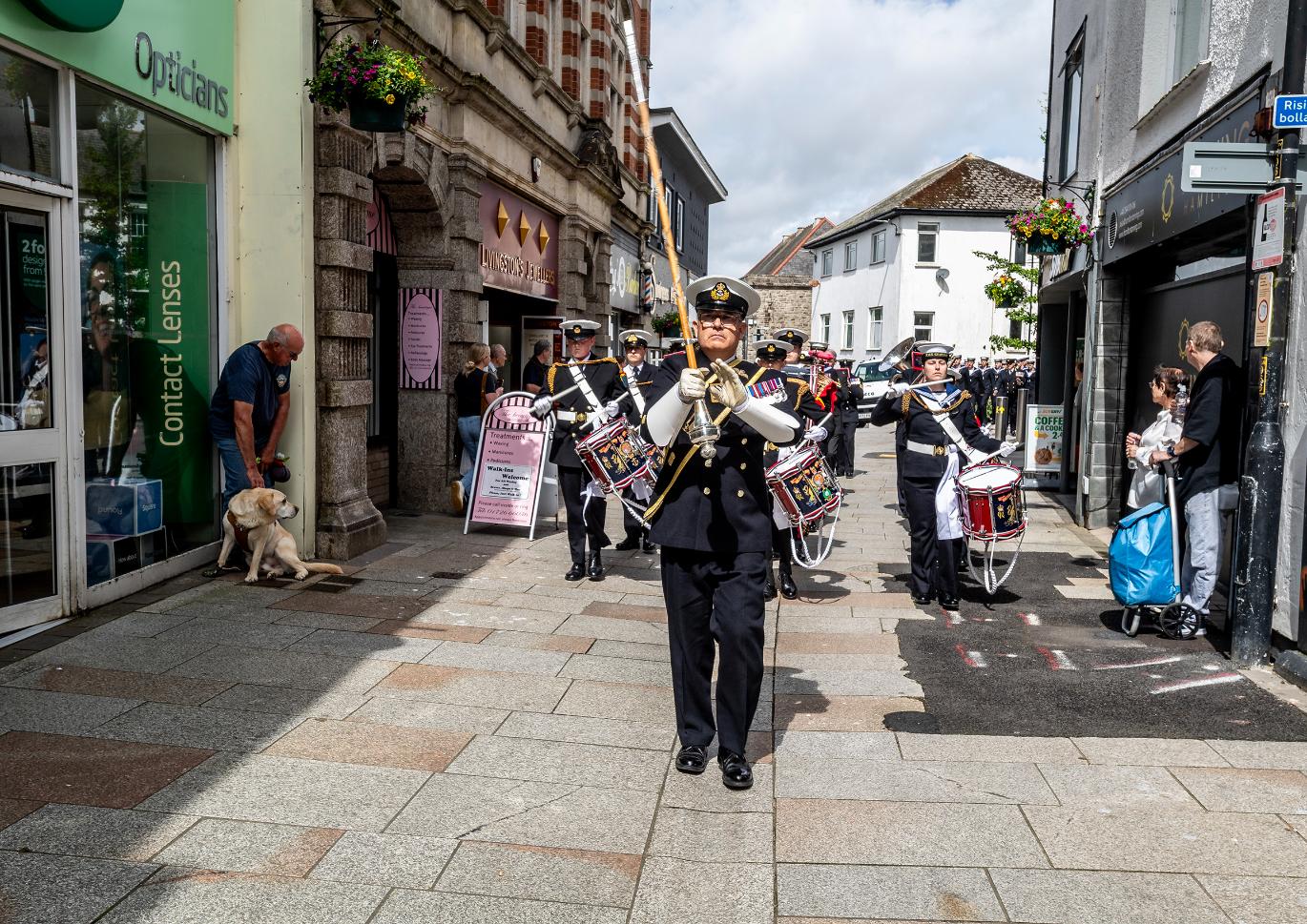 The parade marches through fore street