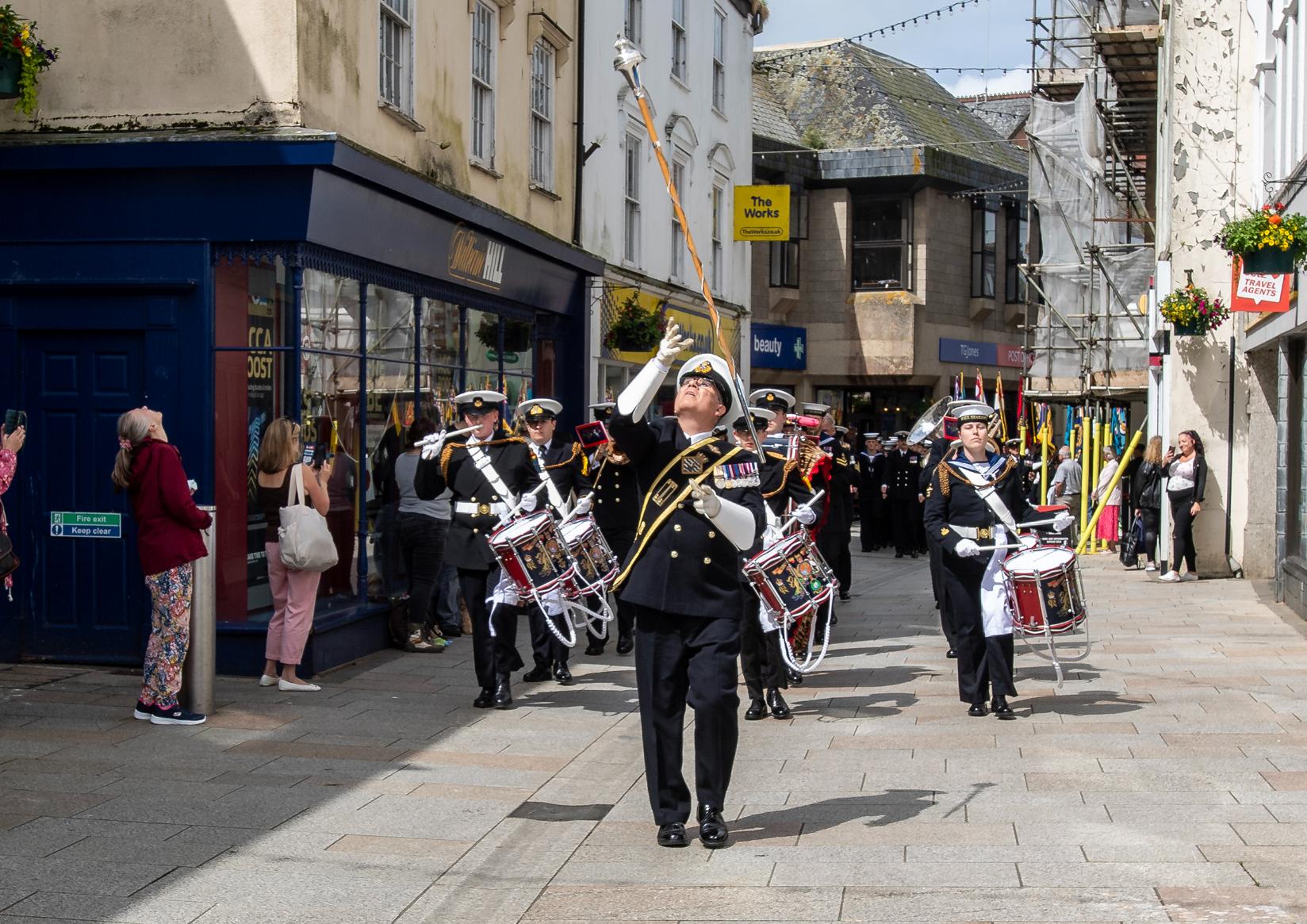 The parade marches through fore street