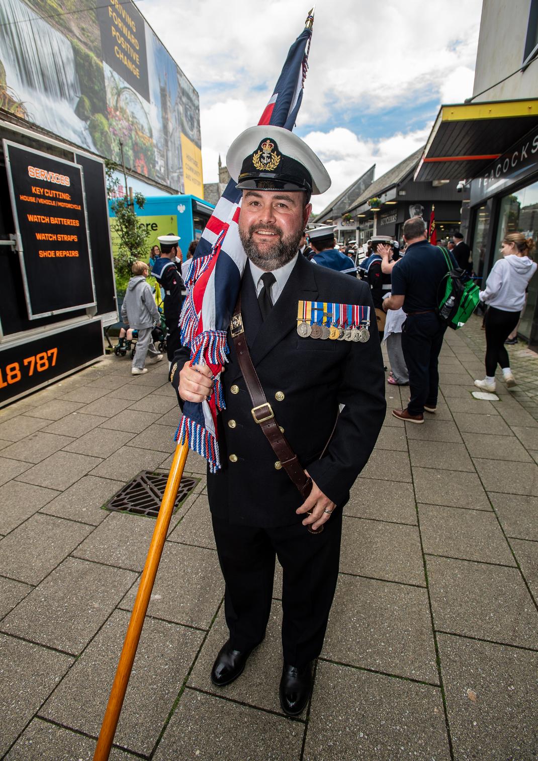 A flagbearer poses