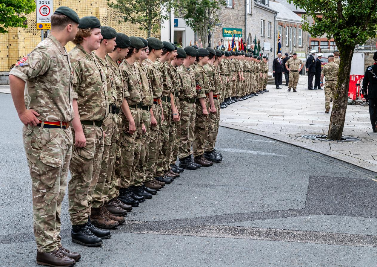Members of the army line up in Biddicks Court