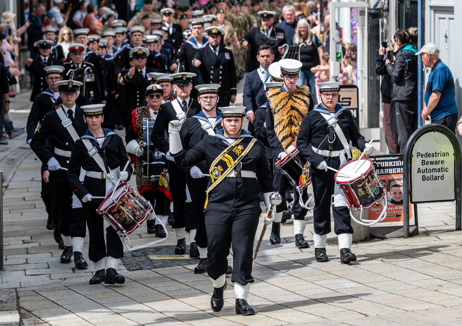 The parade marches through fore street