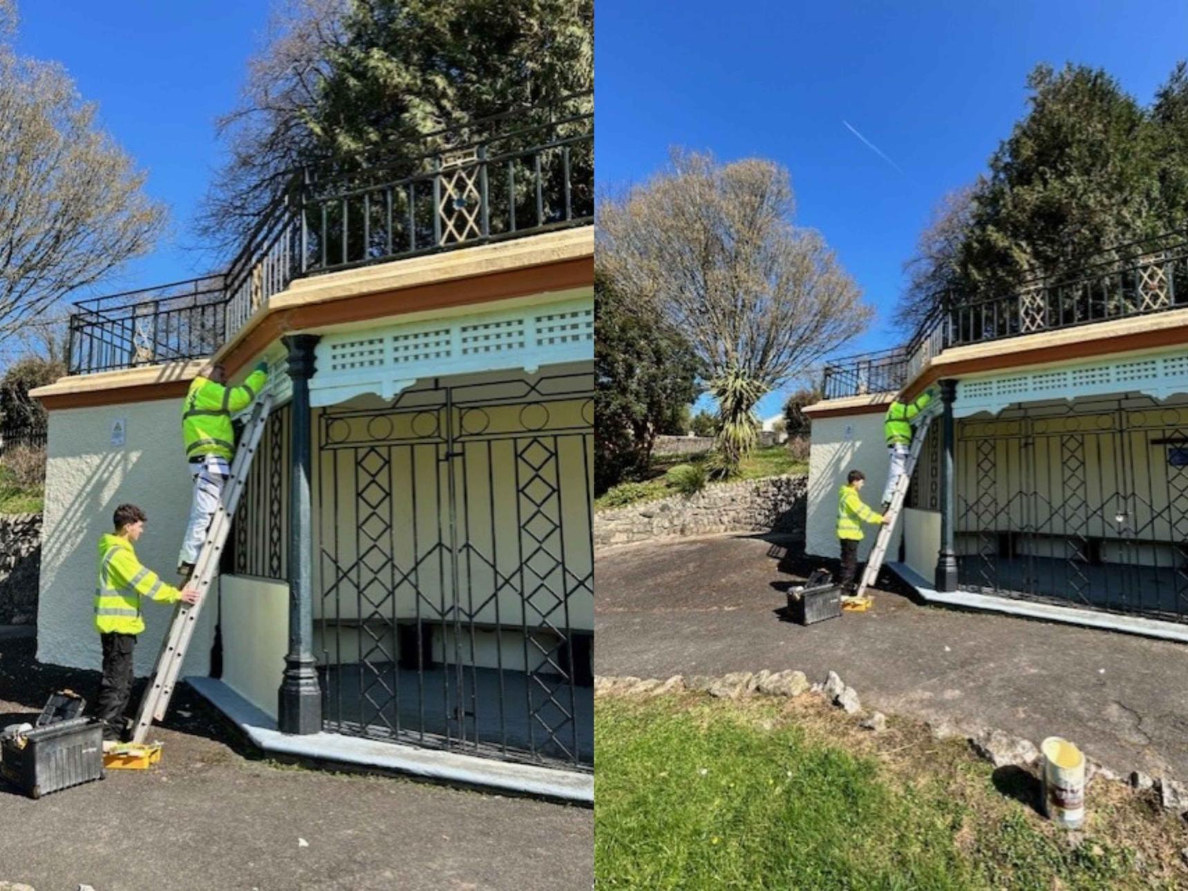 The bandstand is repainted by the two members of the grounds team, April 2025