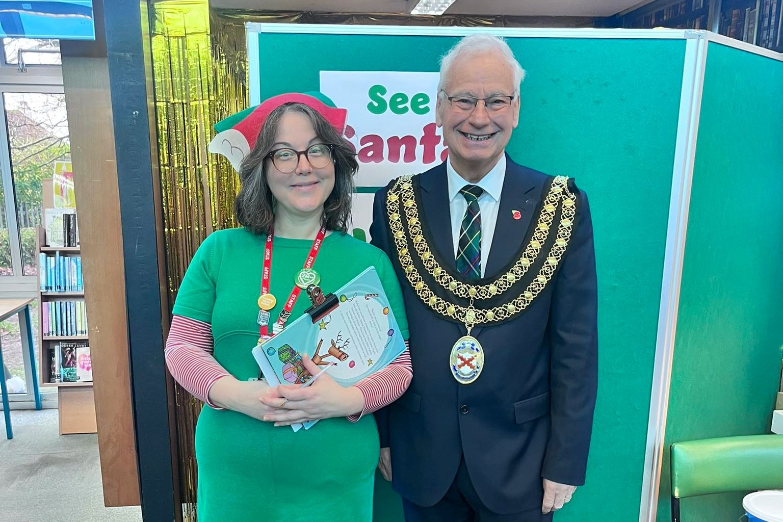 Mayor Colin Hamilton and Santa's Elf at St Austell Library