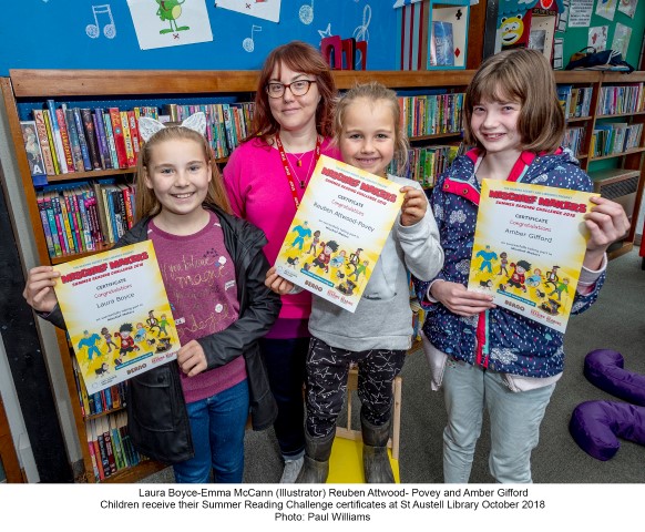 children with their summer reading challenge certificates