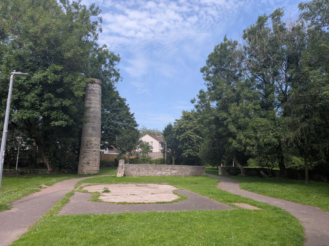 Open space with the ruins of a building on the south side of linear park, 2026