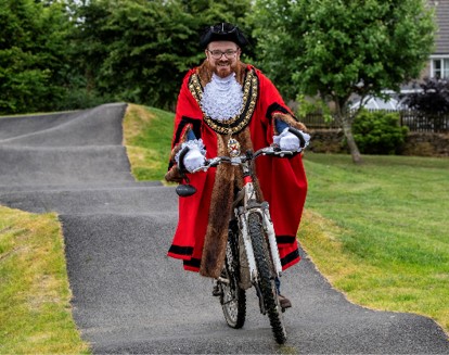Cllr Ethan Stephens rides a bike on the pump track