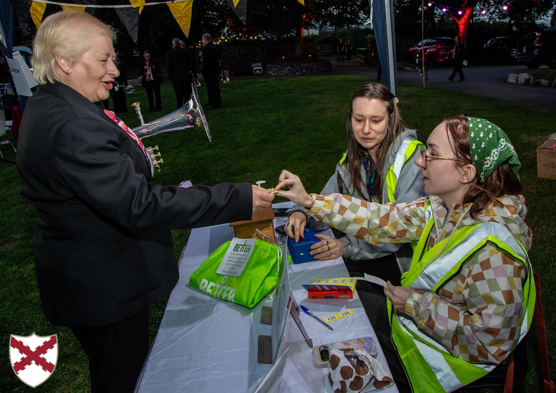 Community Projects Officer and a volunteer selling raffle tickets to raise money for the Mayor's chosen charities. 