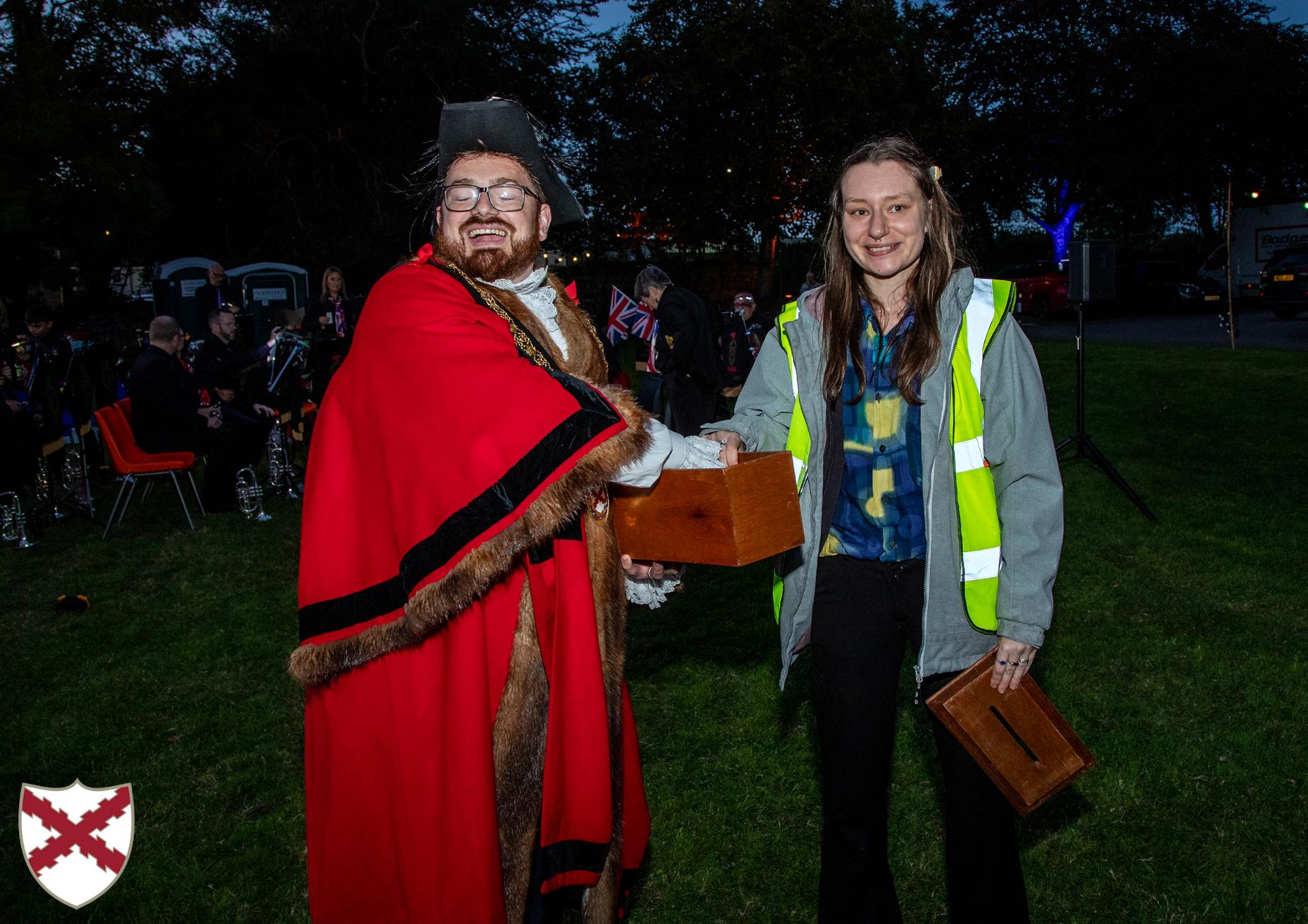 The Mayor draws winning raffle tickets with the Community Projects Officer