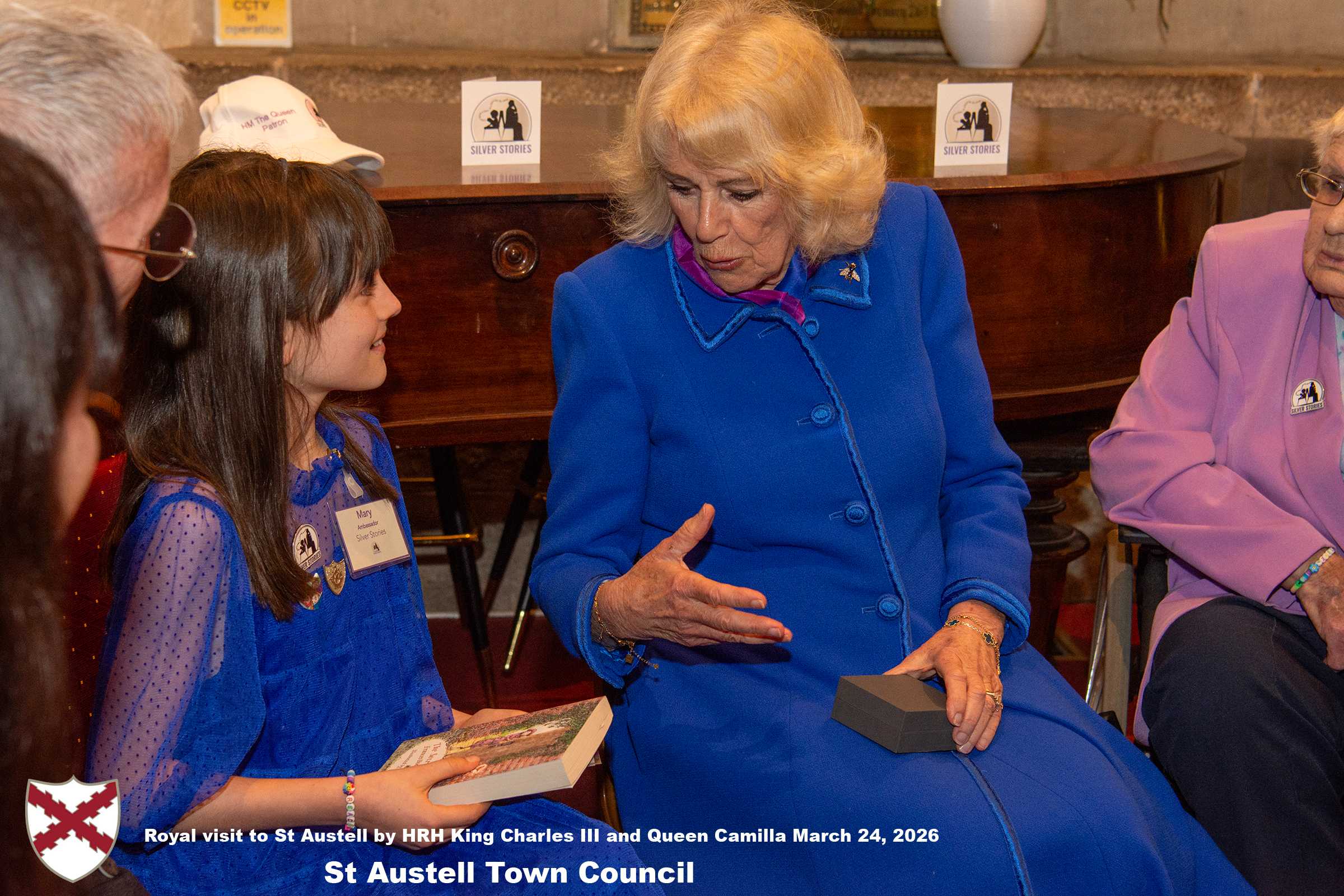 Her Majesty Queen Camilla meets local organisations, volunteers and pupils from a local school at Holy Trinity Church.