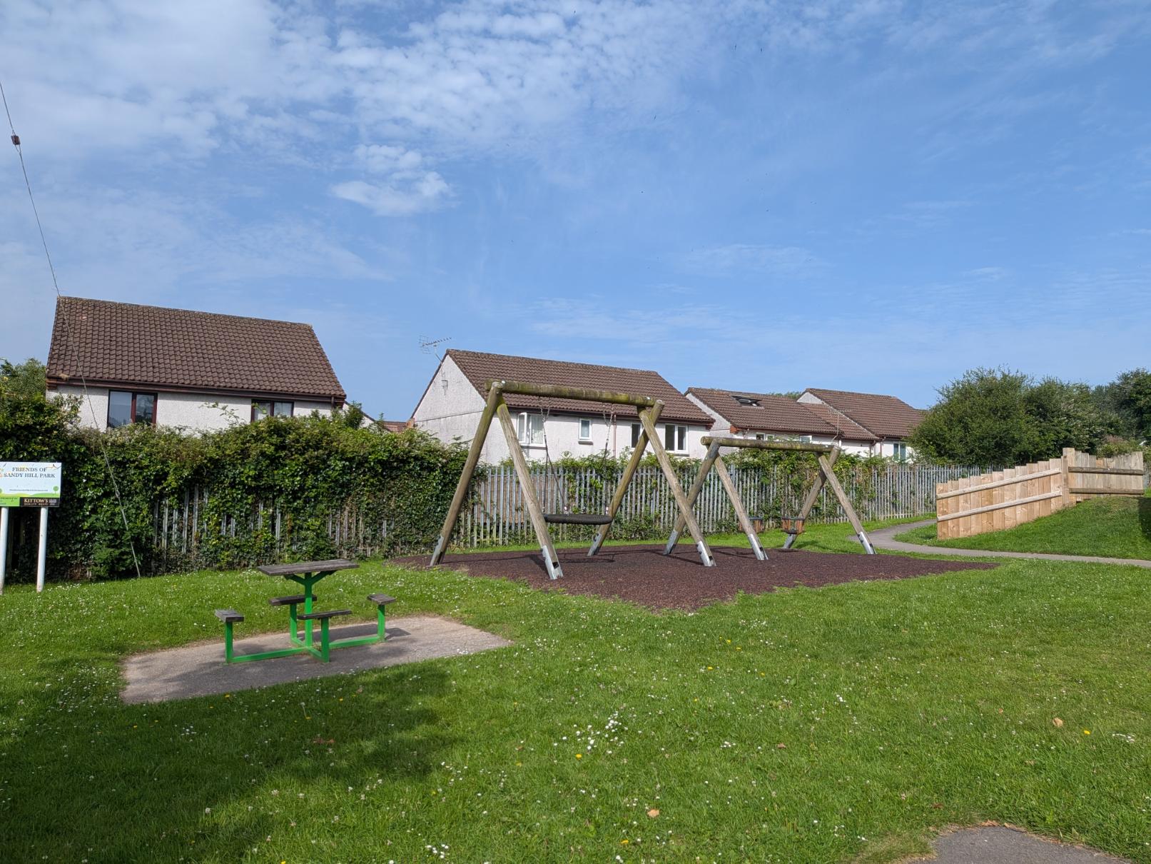 Swings in Sandy Hill Park, June 2026
