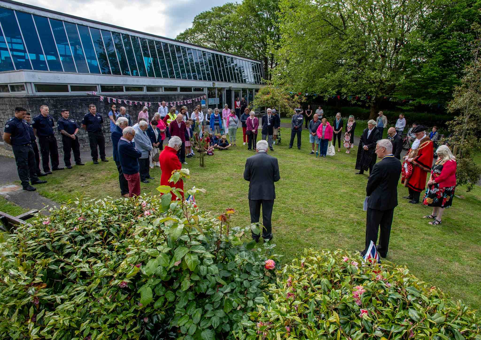 A service for VE Day 2025 takes place outside St Austell Library