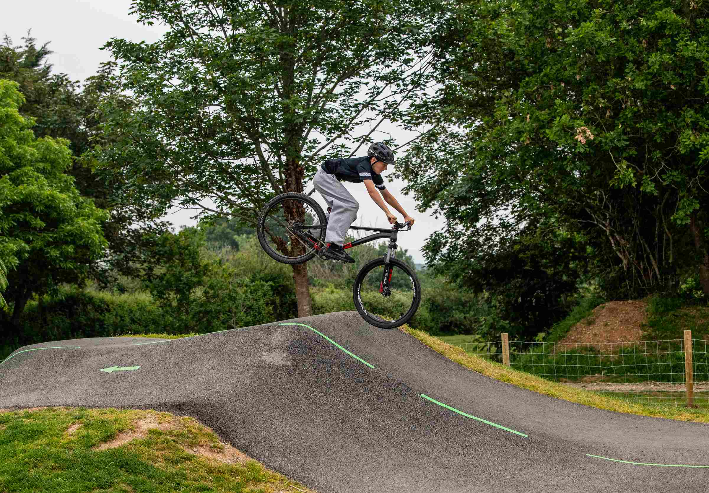 Cllr Ethan Stephens poses on a bike on the pump track