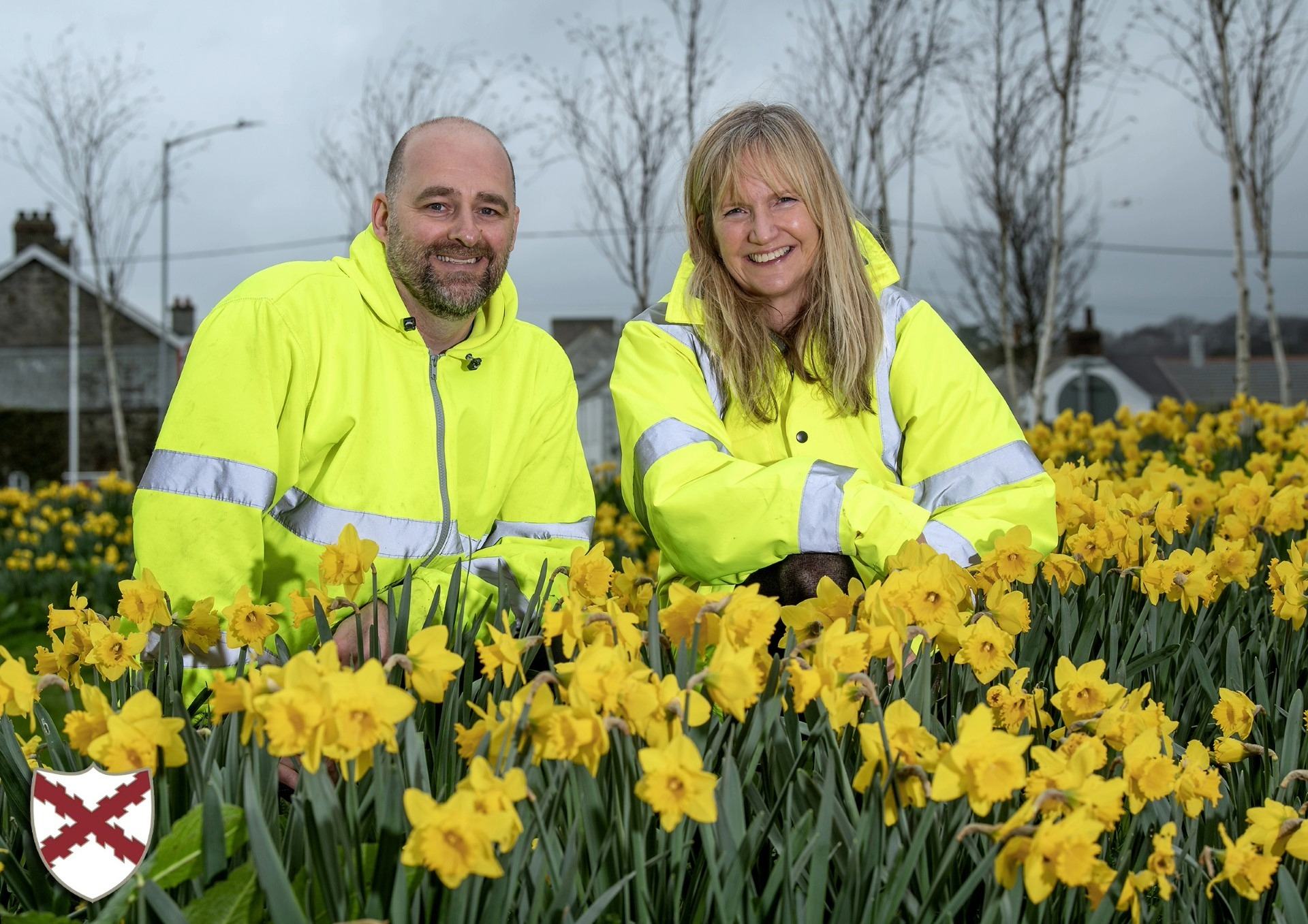Deputy Town Clerk and a member of the grounds team pose in the daffodils, Feb 2026